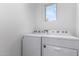 Laundry room features newer washer and dryer at 3597 E Appaloosa Dr, San Tan Valley, AZ 85140