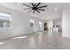 Open living area with tile flooring, plenty of natural light, and a view to the kitchen at 3597 E Appaloosa Dr, San Tan Valley, AZ 85140