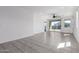 Spacious living room with tile flooring, ceiling fan, and sliding glass door leading to backyard at 3597 E Appaloosa Dr, San Tan Valley, AZ 85140