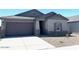 Charming single-story home featuring a two-car garage and neutral paint scheme at 36939 W Santa Maria St, Maricopa, AZ 85138