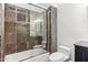 Detailed bathroom with mixed tile shower and glass sliding doors in well-designed space at 38199 N Tranquil Way, Carefree, AZ 85377