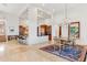 Open floor plan showcasing dining room with chandelier and kitchen with breakfast bar in luxury home at 38199 N Tranquil Way, Carefree, AZ 85377