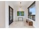 Stylish entryway featuring tile floors, a modern light fixture, and picturesque desert views at 38199 N Tranquil Way, Carefree, AZ 85377