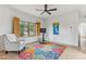 Home gym featuring light walls, colorful floral rug, wood shutters, and exterior view at 38199 N Tranquil Way, Carefree, AZ 85377