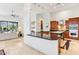 Modern kitchen with granite countertops, stainless steel appliances, and open access to living area at 38199 N Tranquil Way, Carefree, AZ 85377