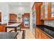 Gourmet kitchen features stainless steel appliances, granite countertops, and custom cabinetry at 38199 N Tranquil Way, Carefree, AZ 85377