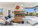 Beautiful living room featuring a stone fireplace and desert views at 38199 N Tranquil Way, Carefree, AZ 85377