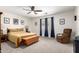 Serene bedroom with a cozy chair, neutral tones, and ample natural light at 4076 E Silverbell Rd, San Tan Valley, AZ 85143
