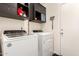 The laundry room features a newer washer and dryer and built in cabinets for storage at 4076 E Silverbell Rd, San Tan Valley, AZ 85143