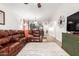 Large living area featuring a plush sectional, modern decor, and an open layout at 4076 E Silverbell Rd, San Tan Valley, AZ 85143