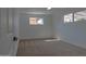 Sunlit carpeted bedroom features neutral walls and ample natural light, creating a serene atmosphere at 4109 N 30Th Ave, Phoenix, AZ 85017
