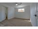 Bright, carpeted bedroom with a ceiling fan and a window offering natural light at 4109 N 30Th Ave, Phoenix, AZ 85017