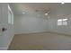 Spacious bedroom boasts neutral carpet, a ceiling fan, recessed lighting, and great natural light at 4109 N 30Th Ave, Phoenix, AZ 85017