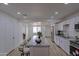 Spacious kitchen with a large center island, white cabinets, stainless steel appliances, and ample counter space at 4109 N 30Th Ave, Phoenix, AZ 85017
