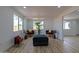Bright living room features wood floors, neutral walls, large windows, and comfortable seating at 4109 N 30Th Ave, Phoenix, AZ 85017