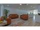 Inviting living room featuring stylish seating, wood-look floors, and a seamless flow into the kitchen area at 4109 N 30Th Ave, Phoenix, AZ 85017