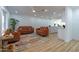 Bright living room with modern furnishings, wood floors, and an open floor plan to the kitchen at 4109 N 30Th Ave, Phoenix, AZ 85017