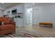 Cozy living room showing the seamless flow to the kitchen, a comfortable seat, and plenty of natural light at 4109 N 30Th Ave, Phoenix, AZ 85017