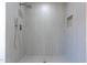 Large walk-in shower features custom tilework, dual shower heads, and a convenient niche at 4109 N 30Th Ave, Phoenix, AZ 85017