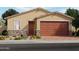 Charming single-story home featuring a neutral color palette, stone accents, and a brick driveway at 4196 W Lisa Ln, San Tan Valley, AZ 85144