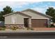 Beautiful single-story home featuring stone accents, desert landscaping, a two-car garage, and a covered front entry at 4315 W Hannah St, San Tan Valley, AZ 85144