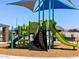 Community playground with slides and climbing structures under a shade canopy offers fun for all at 4315 W Hannah St, San Tan Valley, AZ 85144