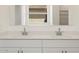 Modern bathroom featuring a double vanity with quartz countertops and sleek chrome fixtures at 4364 W Hannah St, San Tan Valley, AZ 85144