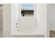 Modern bathroom with soaking tub and a view from the window at 4364 W Hannah St, San Tan Valley, AZ 85144