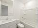 Clean bathroom with a single sink vanity, large mirror, and shower-tub combo at 4364 W Hannah St, San Tan Valley, AZ 85144
