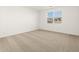 Carpeted bedroom with a window at 4364 W Hannah St, San Tan Valley, AZ 85144