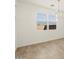 Dining area with tile floors, window views, and a modern chandelier for ambiance at 4364 W Hannah St, San Tan Valley, AZ 85144