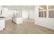 Open-concept kitchen and living area with modern cabinetry and a center island at 4364 W Hannah St, San Tan Valley, AZ 85144