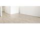 A spacious, bright living room with tile flooring and crisp, white walls at 4364 W Hannah St, San Tan Valley, AZ 85144