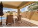 Relaxing covered patio with lounge chairs and a view of the yard, creating an ideal outdoor retreat at 45068 W Alamendras St, Maricopa, AZ 85139