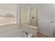Clean bathroom featuring a tub, shower, and lots of natural light at 45068 W Alamendras St, Maricopa, AZ 85139