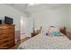 Comfortable bedroom with ample storage, hardwood flooring, and a calming color scheme at 45068 W Alamendras St, Maricopa, AZ 85139