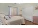 Cozy bedroom with decorative wall accents, closet and comfortable bed at 45068 W Alamendras St, Maricopa, AZ 85139