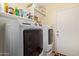 Efficient laundry room with modern washer and dryer, providing convenience for household chores at 45068 W Alamendras St, Maricopa, AZ 85139