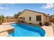 Inviting private pool with lush landscaping, ideal for relaxation and outdoor enjoyment in the backyard at 45068 W Alamendras St, Maricopa, AZ 85139