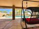 Private backyard oasis with a pool and comfortable swing at 4867 E Windstone Trl, Cave Creek, AZ 85331