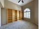 Comfortable bedroom with a built-in bookshelf and a bright window, creating a cozy and functional space at 4867 E Windstone Trl, Cave Creek, AZ 85331