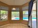 Bright breakfast nook with views of the pool and backyard, featuring striped blinds and a sliding glass door at 4867 E Windstone Trl, Cave Creek, AZ 85331
