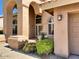 Attractive home exterior with stucco finish, arched entryways, and desert landscaping, enhancing curb appeal and charm at 4867 E Windstone Trl, Cave Creek, AZ 85331