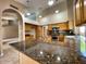 Spacious kitchen with granite countertops, stainless steel appliances, and a large island at 4867 E Windstone Trl, Cave Creek, AZ 85331