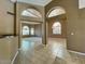 Open-concept living room with tile floors and archways at 4867 E Windstone Trl, Cave Creek, AZ 85331