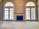 Living room with a fireplace, two sets of doors and windows at 4867 E Windstone Trl, Cave Creek, AZ 85331