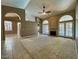 Large living room with high ceilings, a ceiling fan, and tile flooring at 4867 E Windstone Trl, Cave Creek, AZ 85331