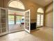 Bright living room offering access to covered patio and private pool at 4867 E Windstone Trl, Cave Creek, AZ 85331