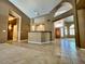 Spacious living room with tiled floors, bar, and front door at 4867 E Windstone Trl, Cave Creek, AZ 85331