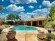 Backyard pool with lush landscaping and a spacious patio area at 4867 E Windstone Trl, Cave Creek, AZ 85331